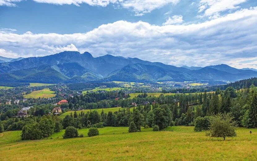 A view of The Tatra Mountains and village in summer, Poland.